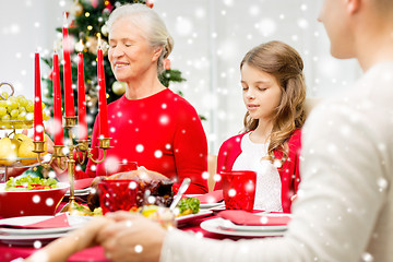 Image showing smiling family having holiday dinner at home