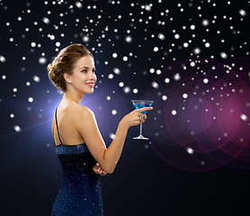 Image showing smiling woman holding cocktail