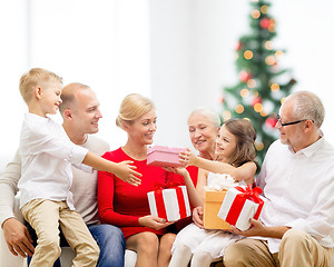 Image showing smiling family with gifts