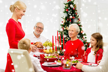 Image showing smiling family having holiday dinner at home