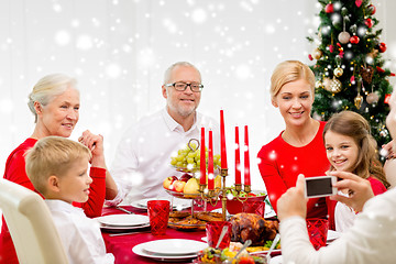 Image showing smiling family having holiday dinner at home