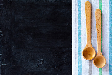 Image showing wooden spoons and tablecloth 