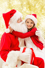 Image showing smiling little girl with santa claus