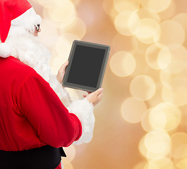 Image showing man in costume of santa claus with tablet pc