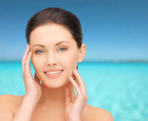 Image showing beautiful young woman over blue sky and sea