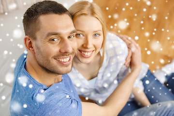 Image showing happy couple hugging at home