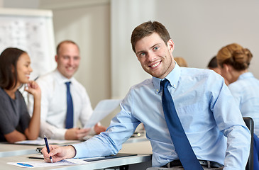 Image showing group of smiling businesspeople meeting in office