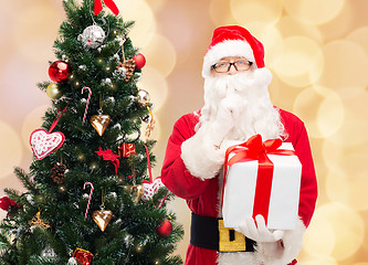 Image showing man in costume of santa claus with gift box