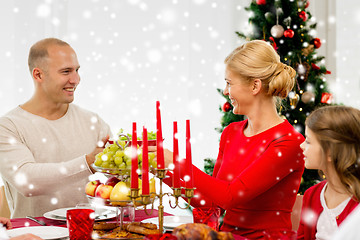 Image showing smiling family having holiday dinner at home