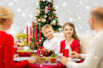 Image showing smiling family having holiday dinner at home