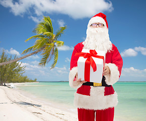 Image showing man in costume of santa claus with gift box