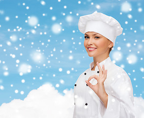 Image showing smiling female chef showing ok hand sign