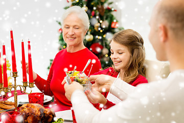 Image showing smiling family having holiday dinner at home