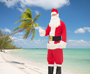 Image showing man in costume of santa claus showing thumbs up