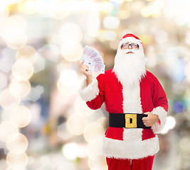 Image showing man in costume of santa claus with euro money