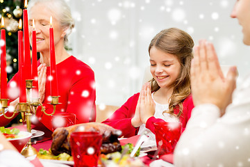 Image showing smiling family having holiday dinner at home