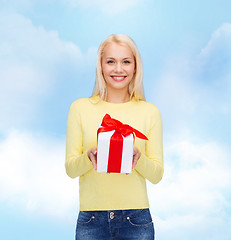 Image showing smiling girl with gift box