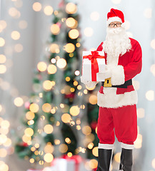 Image showing man in costume of santa claus with gift box