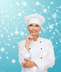 Image showing smiling female chef dreaming