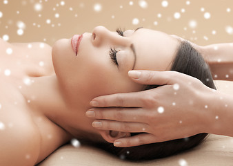 Image showing beautiful woman getting face or head massage