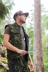 Image showing young soldier or hunter with knife in forest