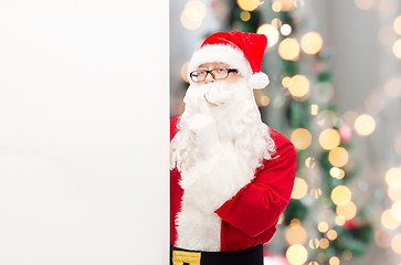 Image showing man in costume of santa claus with billboard