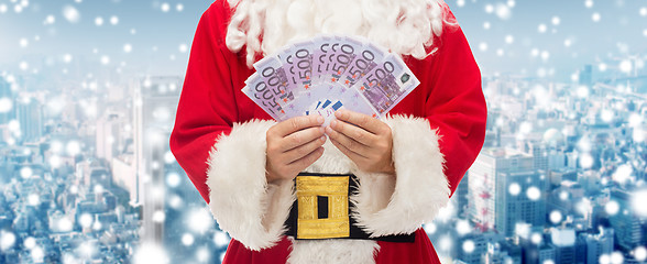 Image showing close up of santa claus with euro money