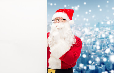 Image showing man in costume of santa claus with billboard