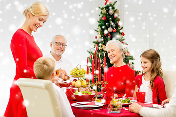 Image showing smiling family having holiday dinner at home