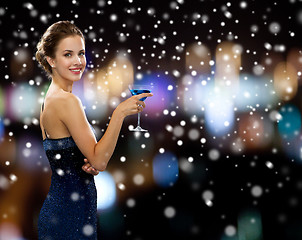 Image showing smiling woman holding cocktail