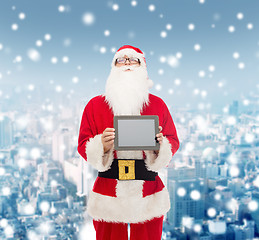 Image showing man in costume of santa claus with tablet pc