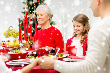 Image showing smiling family having holiday dinner at home