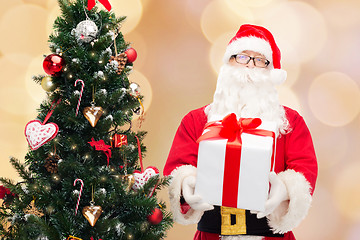 Image showing man in costume of santa claus with gift box