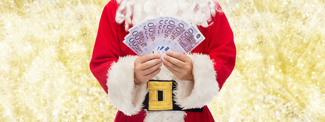 Image showing close up of santa claus with euro money