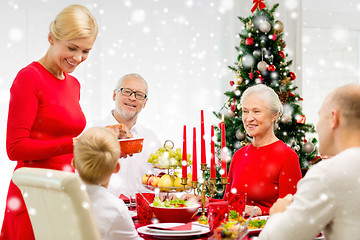 Image showing smiling family having holiday dinner at home