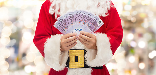 Image showing close up of santa claus with euro money