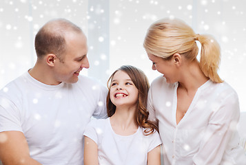 Image showing smiling parents and little girl at home