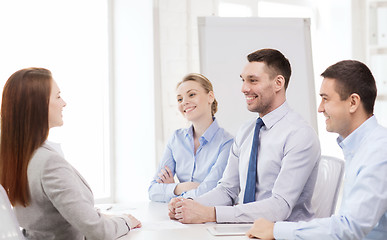 Image showing smiling businesswoman at interview in office