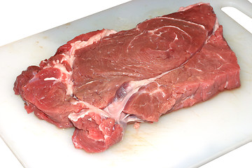 Image showing Photo of the juicy beef meat on a cutting board