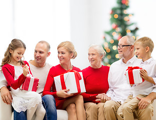 Image showing smiling family with gifts