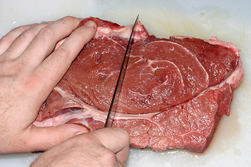 Image showing Photo of the juicy beef meat on a cutting board