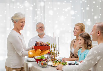 Image showing smiling family having holiday dinner at home