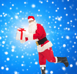 Image showing man in costume of santa claus with gift box