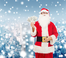 Image showing man in costume of santa claus with dollar money