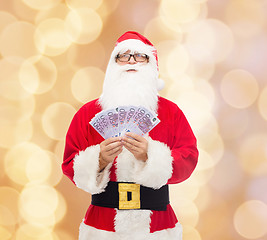 Image showing man in costume of santa claus with euro money