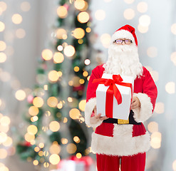 Image showing man in costume of santa claus with gift box