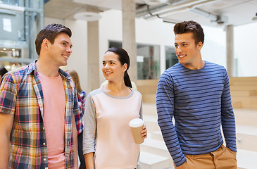 Image showing group of smiling students with paper coffee cups