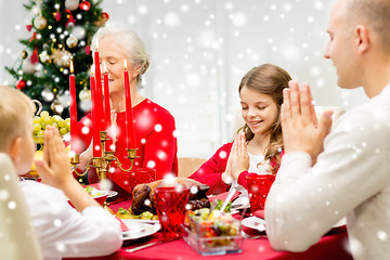 Image showing smiling family having holiday dinner at home