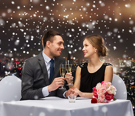Image showing smiling couple at restaurant