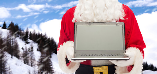 Image showing close up of santa claus with laptop